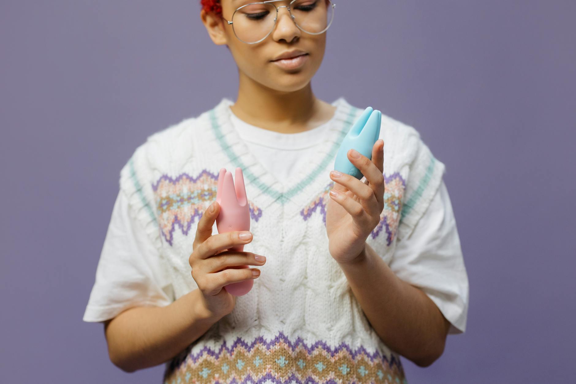 Two people exploring together with clitoral vibrators in a moment of intimate connection